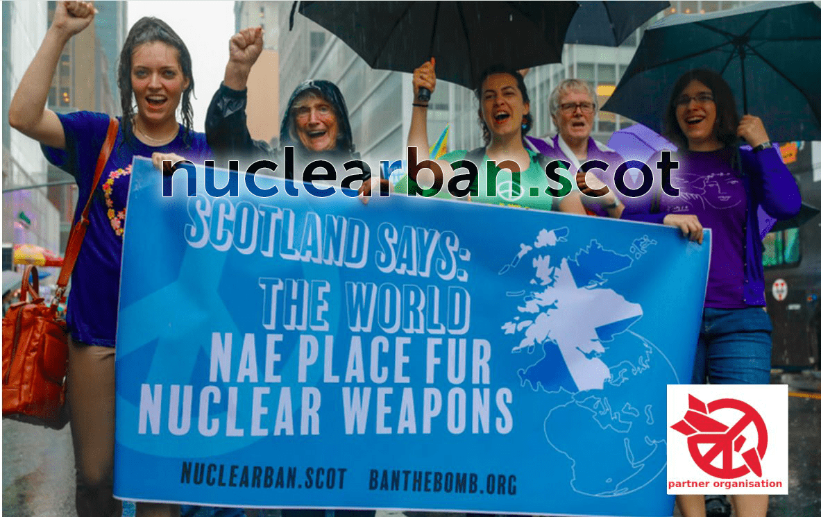Image of protestors in New York with banner reading “Scotland Says: The World Nae Place Fur Nuclear Weapons” (The World is no place for Nuclear Weapons).